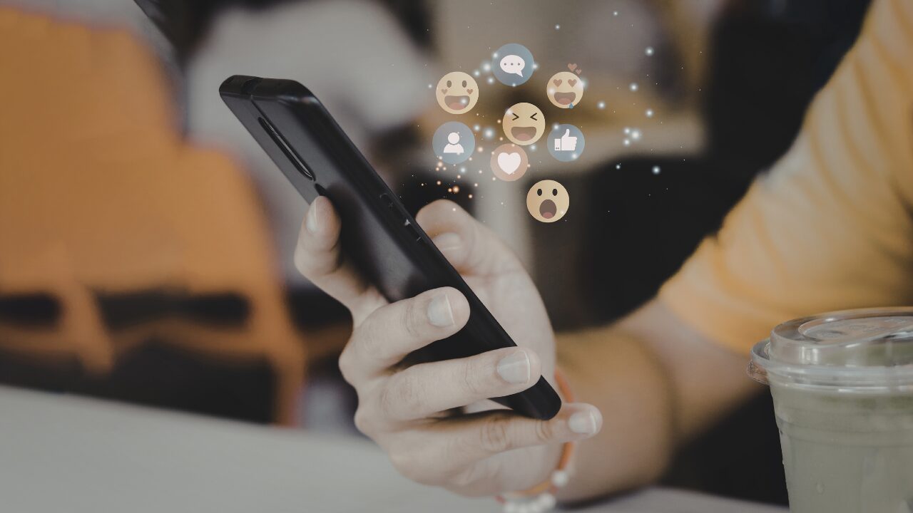 Person interacting with mobile communication apps