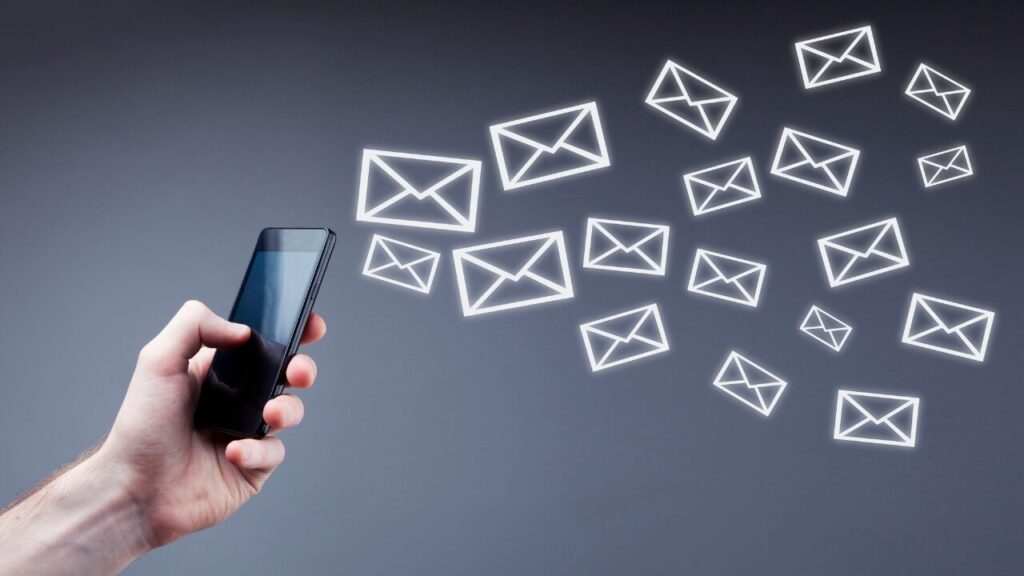 Person sending a message on mobile phone